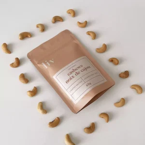 Artisanal hand-roasted cashews by LIV in three gourmet flavours: Lightly Salted, Lime & Saffron, and Spicy (Mild), displayed in elegant packaging.